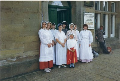 Group in period costume outside the old Jail house, Dornoch
