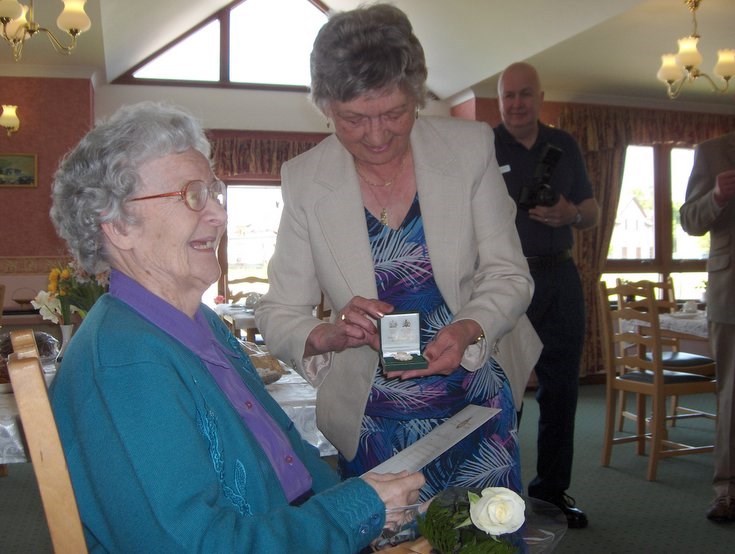 Women's Land Army Badge presented to Isabella Gray  (Dornoch)