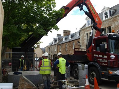 Lifting of the large granite seat for removel from Mercat Cross area