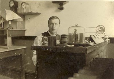 Photograph of Mr Paul at his work bench.