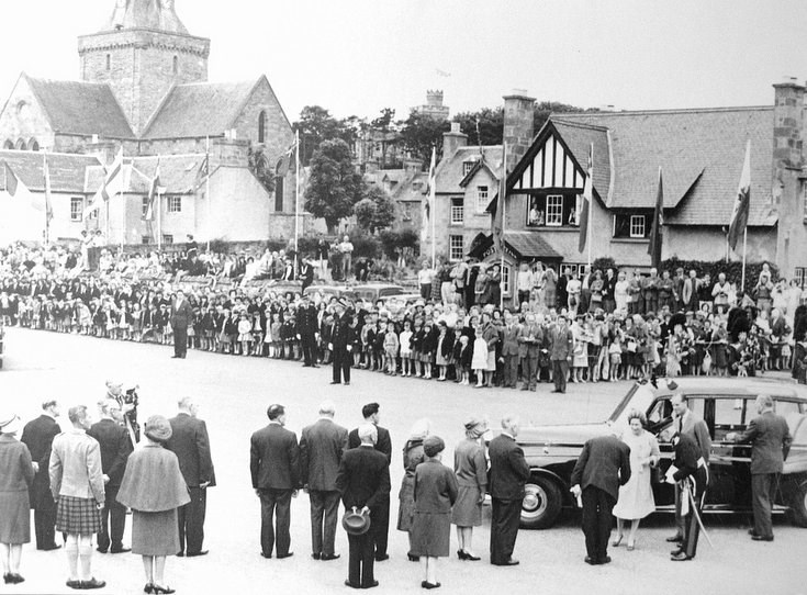 Photograph of the Queen and Duke of Edinburgh in Dornoch Square