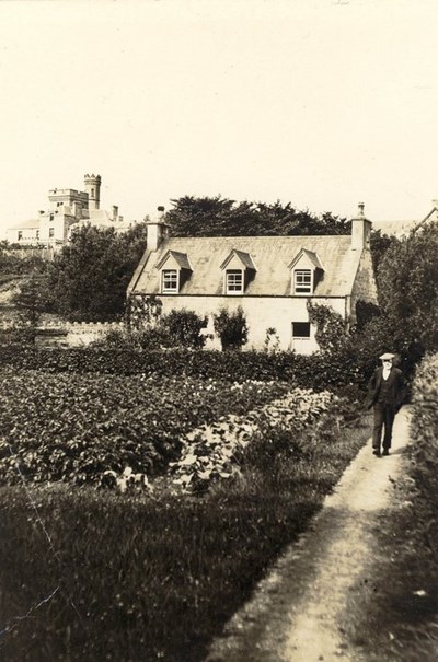 Garden of 'Kaiapoi', Dornoch with postie John Mackay