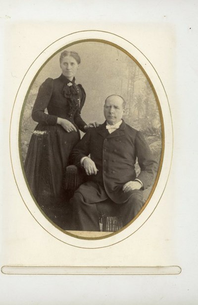 Studio portrait of a gentleman and lady