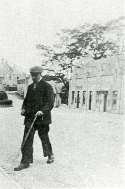 Gentleman with cane in High Street, Dornoch