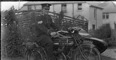 Police Sergeant on motorcycle with sidecar