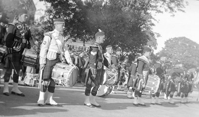 Dornoch Pipe Band standing at ease