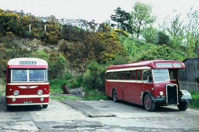 Two single deck buses of different age at Dornoch 