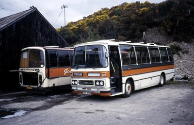 Two 1974 registration single deck buses at Dornoch