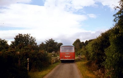 Single deck bus negotiating the single track road 
