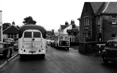 Bus congestion outside the Post Office in Lairg
