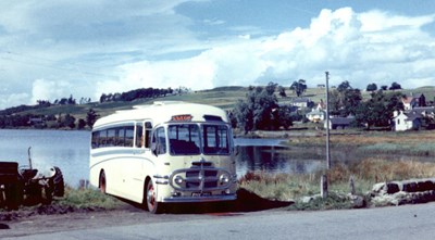Coach parked on the bank of Loch Shin at Lairg