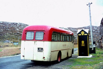 Rear view Scourie service bus parked at Laxford 