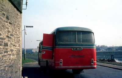 Rear view of Highland mail bus in Thurso