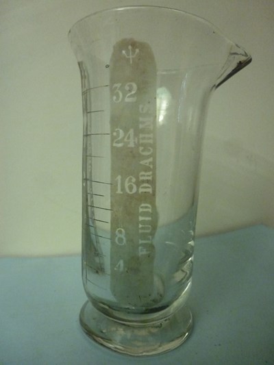 Small glass measuring flask