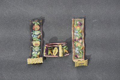 Embroidered bands with metal clasps