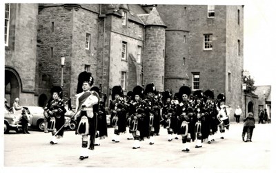 Monochrome photograph of Dornoch Pipe Band