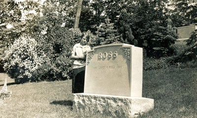 Lillian Ross standing at her mother's gravestone