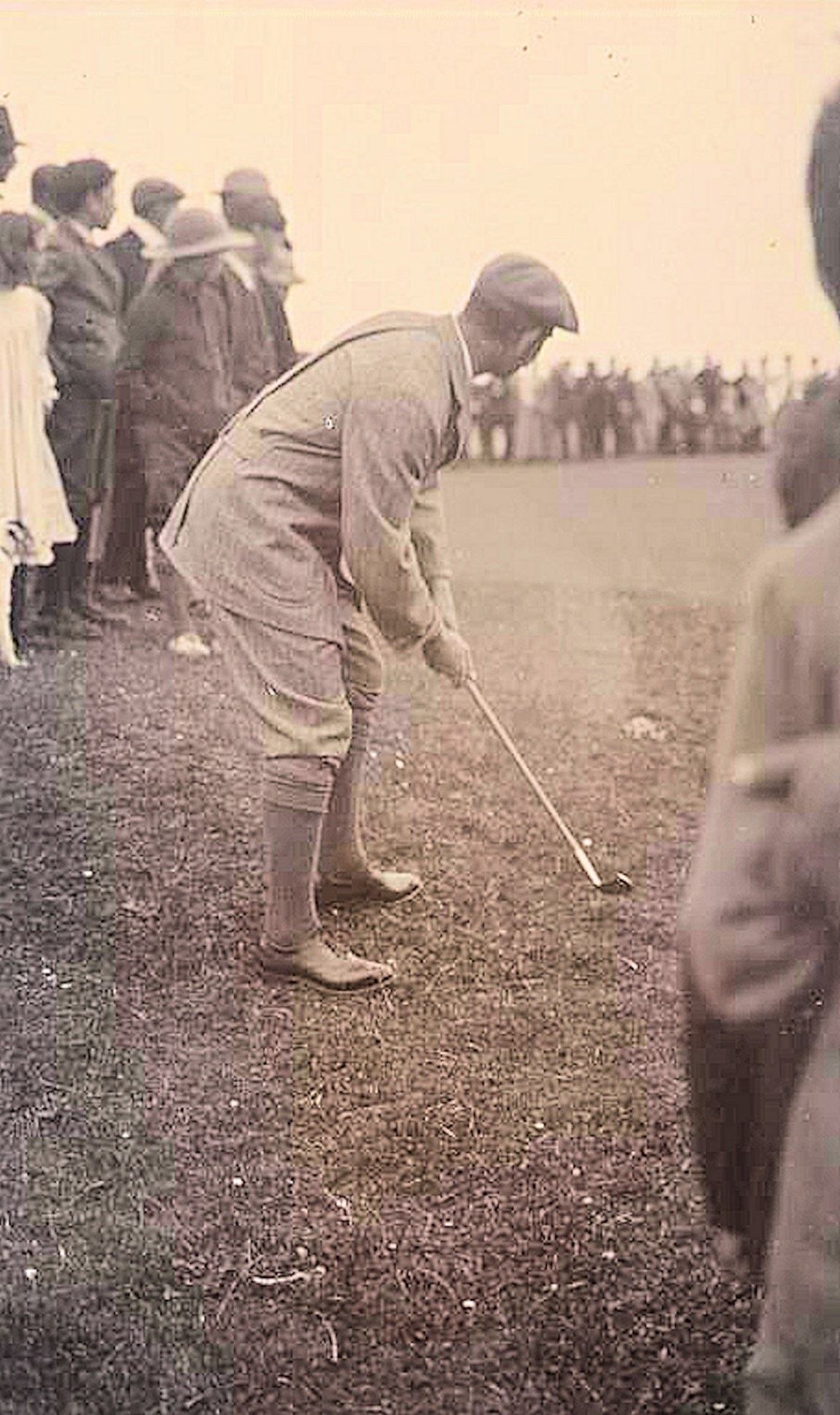 Golfer chipping onto the green