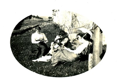 Grant family group relaxing in a garden