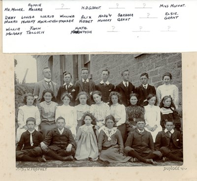 Sepia group photo of school class with hand written legend above