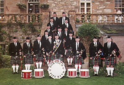 Colour postcard pf Dornoch Pipe Band