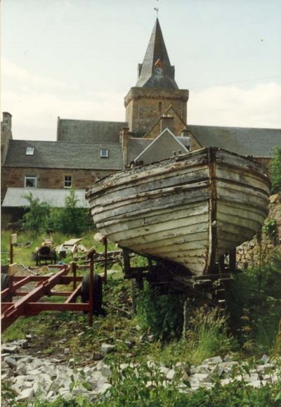 Old ferry boat behind cathedral