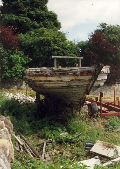 Old ferry boat behind cathedral