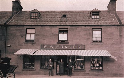 W S Fraser's shopfront, Councillors,  large group of men