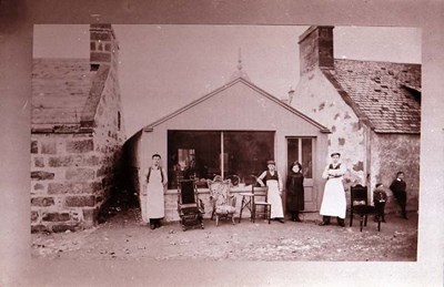 Cabinet makers Church St, Family group with pram, Dornoch from SE