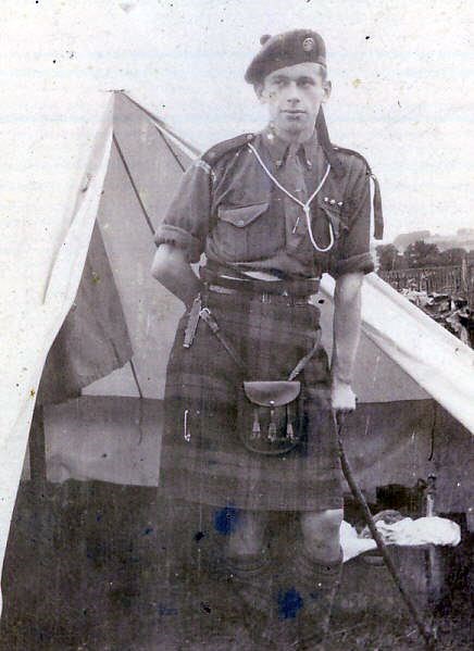 Scout at door to bell tent