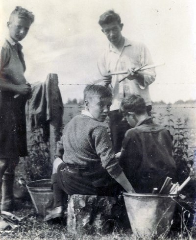 Scouts preparing rhubarb at camp