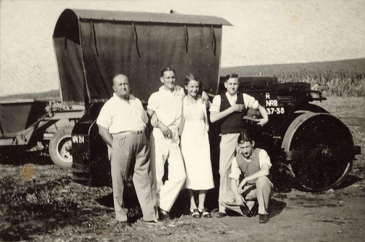 Thomas Hardie, together with three young men and a young woman, in front of a steam roller/tractor