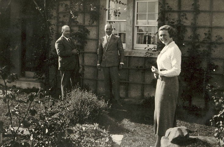 Two Gentlemen and a Lady, in a garden