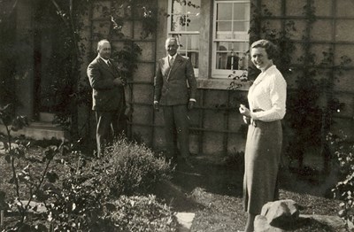 Two Gentlemen and a Lady, in a garden