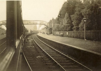 Train pulling into, or out of, a station