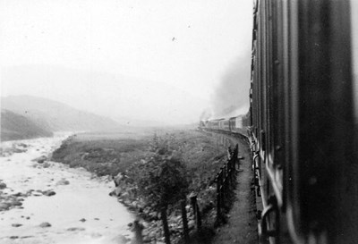 Train passing a river