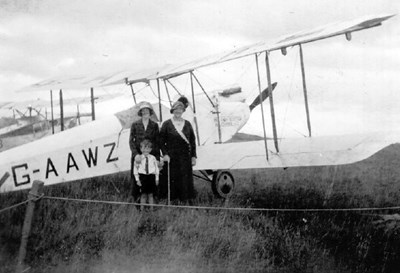 Two Women and a Boy standing in front of G-AAWZ