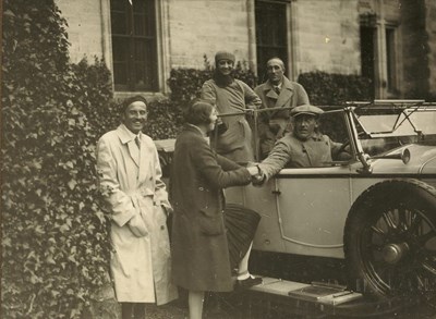 Group of five people and car taken at time of 1928 pageant