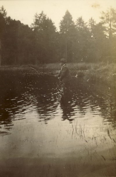 Mr Hardie, Factor of Skibo Estate, fishing at a lake
