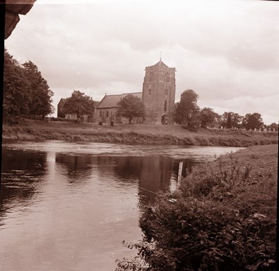 Llrge church beside a river at 