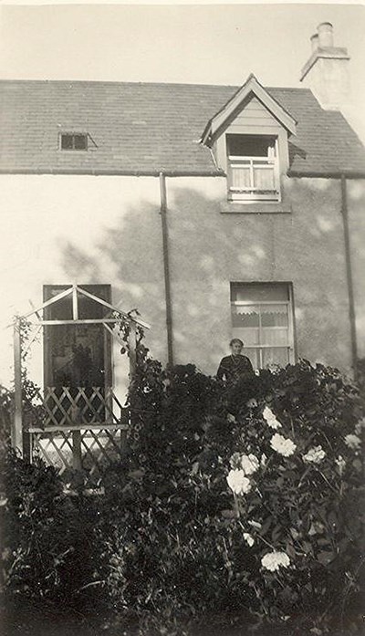 Lady and front garden of Three Trees